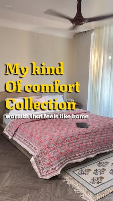 A Gul Dhaga quilt layered into a warm lived-in bedroom